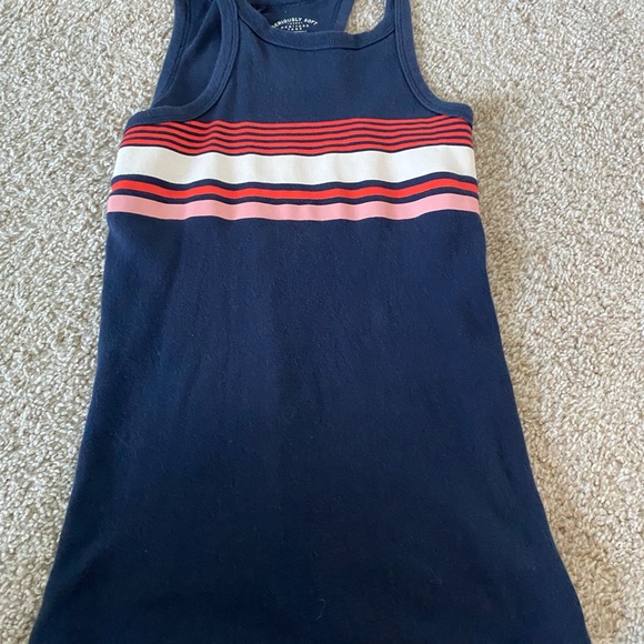 This is a navy blue tank top with red and white and pink strip design. Size XS. - Picture 2 of 3